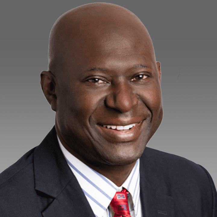 Adama-Kah-Headshot-2.01.22-grey-background